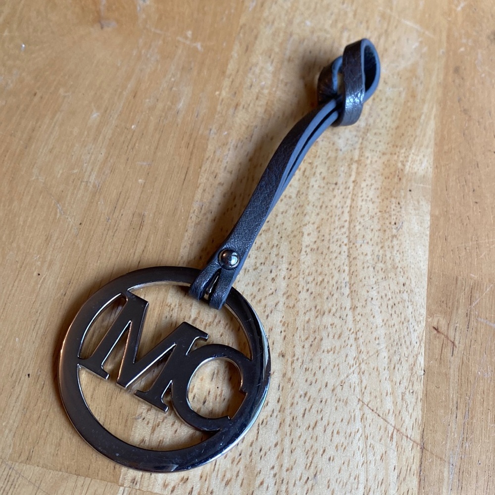 MC bag charm in good condition